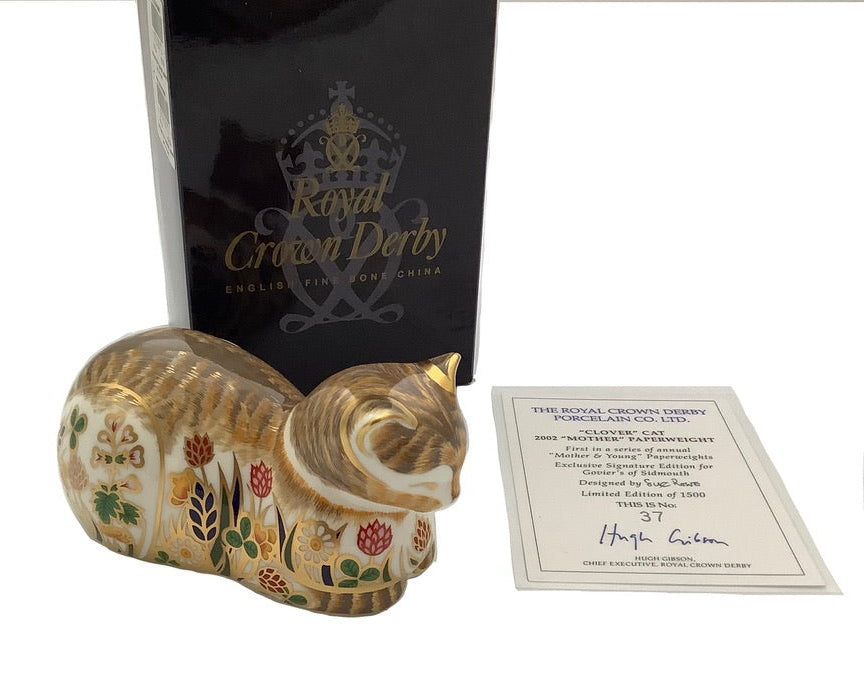 Royal Crown Derby Clover Cottage Garden Cat Paperweight with 22 carat gold decoration, presented with its original box and certificate.